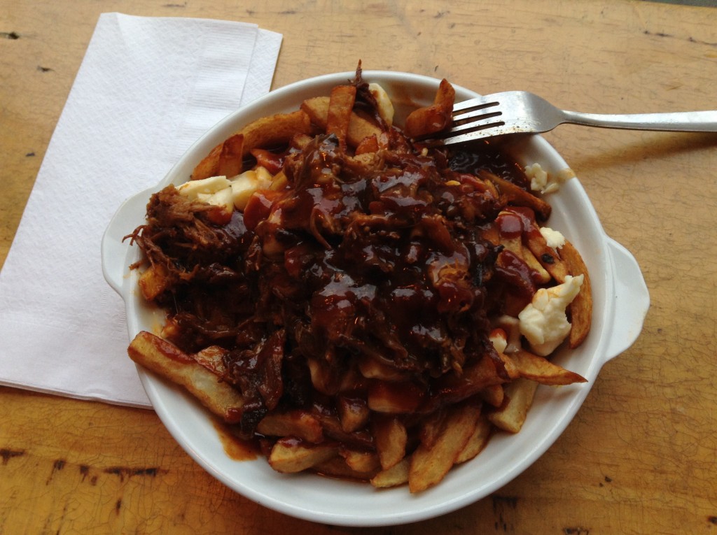 Poutine, a local Quebec delicacy of fries, cheese curds, meat and gravy.